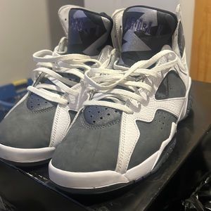 I am selling a pair of grey,white and purple retro Jordan 7s size 9